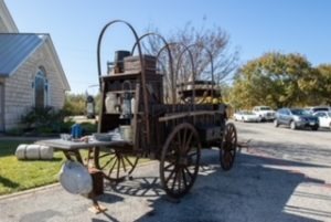 Photo of chuck wagon in front of chapel