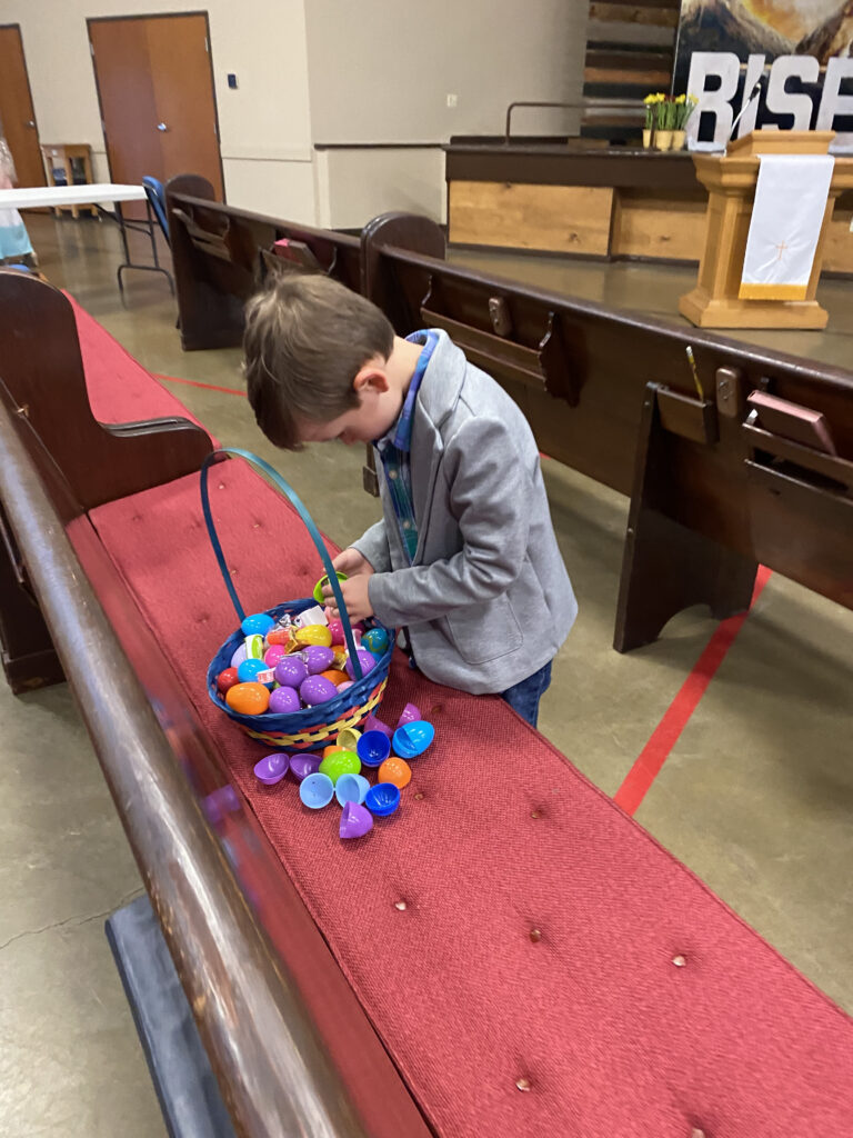 Boy checking out his Easter egg collection.